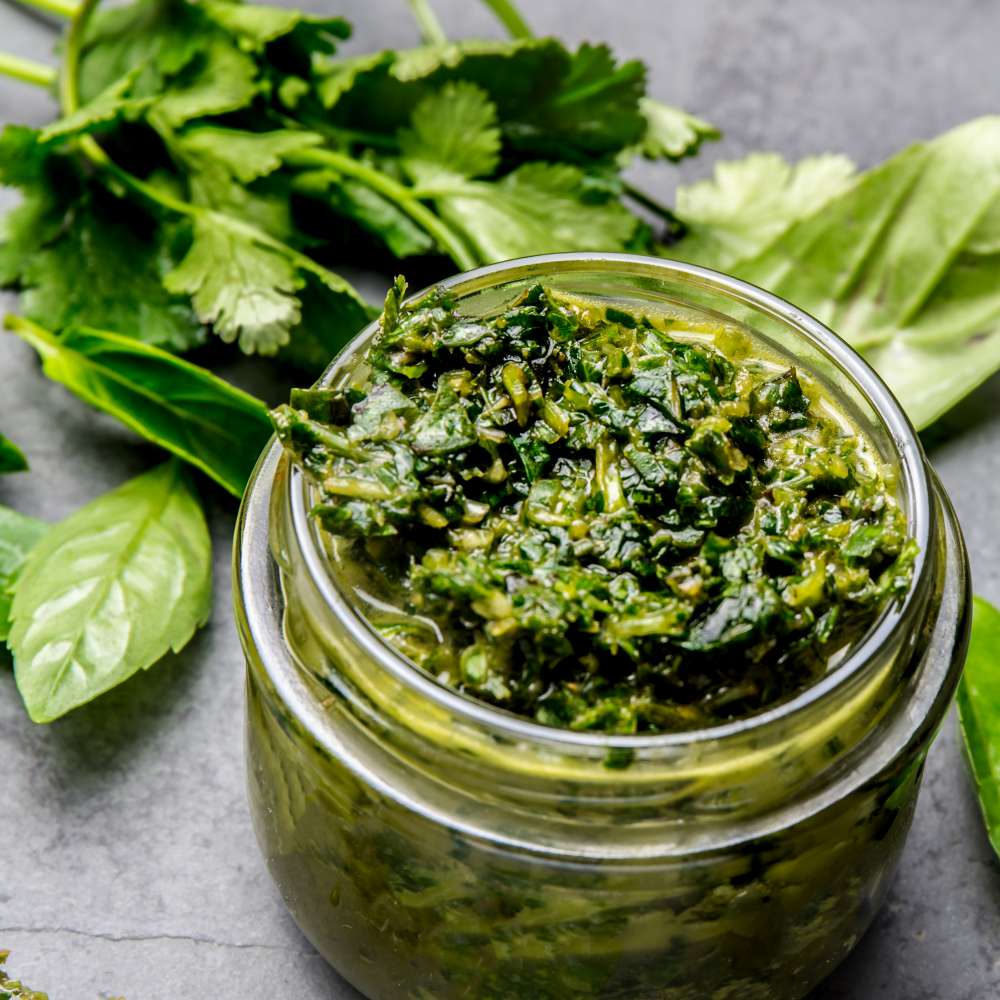 Chimichurri sauce argentine green parsley basil sauce chimichurri barbecue asado glass jar