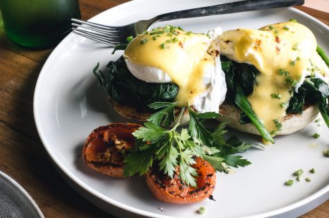 Foodiesfeed com poached eggs with spinach on a brioche