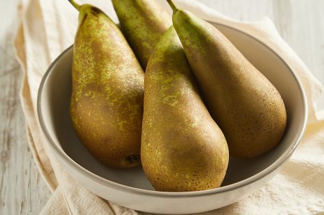 Fresh green pears wooden table